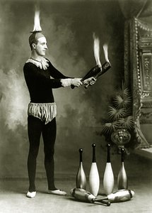 J.T. Doyle, Circus and Carnival Juggler with Flaming Pins and Bowl, c.1902 by J.E. Pasonault